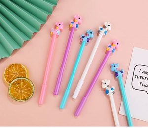 Close-up of cute cartoon giraffe gel pens in pink, purple, blue and white colors