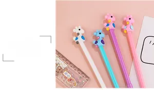 Set of four cute cartoon giraffe gel pens in pastel colors with matching ruler