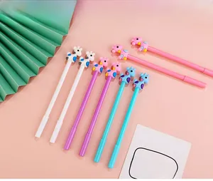 Close-up of colorful cartoon giraffe gel pens in pink, purple, blue and white colors