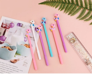 Detailed view of colorful giraffe gel pens with soft silicone heads on a pink background