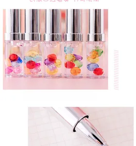 Detail of creative lipstick-shaped gel pens with colorful liquid floating beads and charms