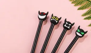 Detail of four creative cartoon devil gel pens with colorful silicone character heads