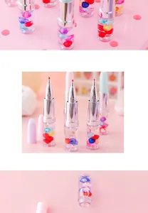 Close-up of lipstick-shaped gel pen with transparent barrel and colorful heart beads