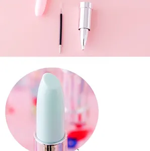 Detail of creative lipstick-shaped pen with detachable pink body and black ink refill