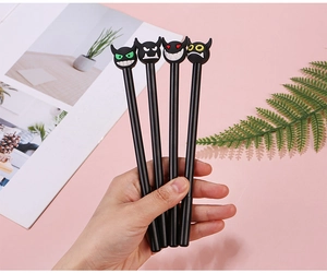 Set of four creative black ink gel pens with diverse devil character head toppers