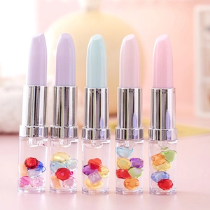 Five lipstick-shaped pens in macaron colors with transparent beads in the body