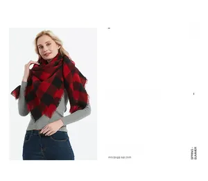 Close-up of red and black buffalo plaid scarf featuring soft fringe edge details