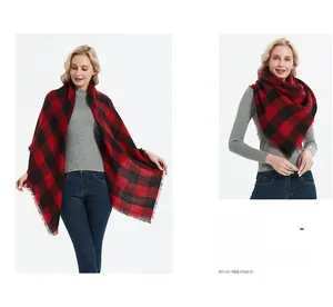 Detail of red and black buffalo plaid shawl scarf with fine tassels for winter wear