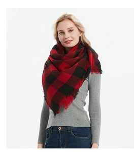 Detailed close-up of red and black buffalo check scarf with soft tassel edges