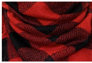Close-up of red and black buffalo plaid cashmere-like scarf with fringe details