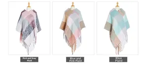 Detailed view of three plaid ponchos with long fringes and knit texture on mannequins