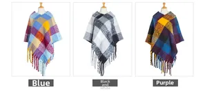 Detailed view of thick knit poncho featuring checkered patterns and long fringe tassels