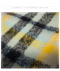 Macro shot of soft knit fabric with yellow and blue plaid pattern and fluffy texture