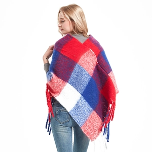 Women's thick plaid poncho with red and blue checkered pattern and fringe tassels