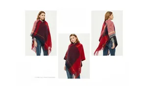Detail of checkered knit poncho featuring asymmetrical long fringe in red and blue