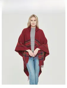 Detail of vintage burgundy plaid shawl with fringe hem and classic checkered pattern