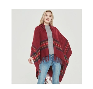 Detail of burgundy poncho cape with multi-color striped patterns and fringe trim