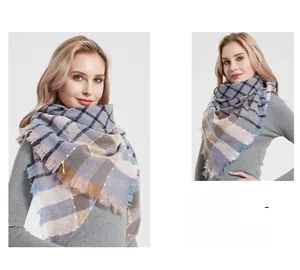 Detailed close-up of grey plaid shawl with colorful speckles and thick knit texture