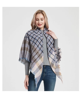 Detail of soft plaid scarf with fringe edges and subtle colorful decorative lines