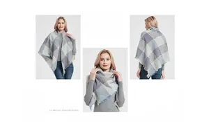 Close-up of grey and blue plaid knit shawl with delicate fringe details for winter
