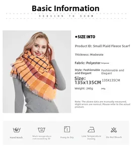 Detail of soft orange plaid scarf fabric texture and tassel fringe edge design