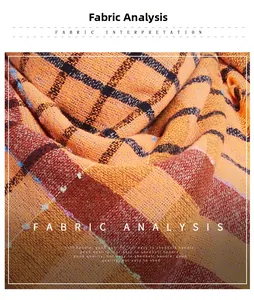 Detailed texture of thick orange plaid scarf fabric with soft loop yarn and fuzzy finish