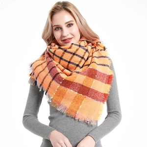 Thick orange plaid shawl scarf with fringes made of soft checkered knit fabric
