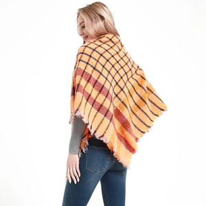 Thick orange plaid scarf with classic check pattern and frayed fringe for autumn winter