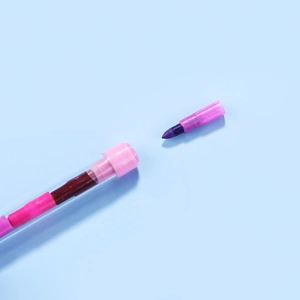 Detail view of pink and purple detachable building block crayons with wax core segments