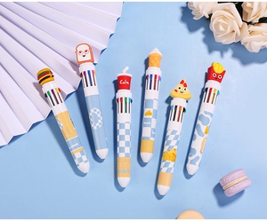 Detail of 6 multi-color ballpoint pens with cartoon food toppers on blue background