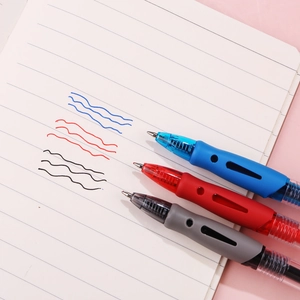 Three minimalist retractable gel pens in blue red and grey on a lined notebook page