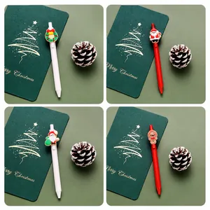 Close-up of Christmas gel pen set with Santa, Gingerbread Man and Wreath silicone toppers