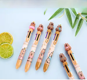 Close-up of cute Capybara cartoon multi-color pens with decorative toppers on blue background