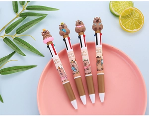 Detail of four-color capybara retractable pens with 3D cartoon dolls in a decorative tray