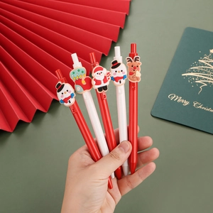 5-pack Christmas gel pens set with Santa and snowman silicone charms in hand