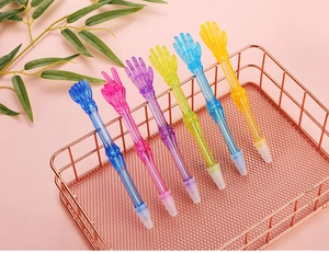 Creative skeletal hand ballpoint pens with different gestures in a rose gold metal basket