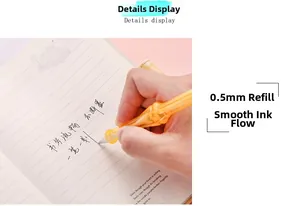 Close-up of translucent orange gesture pen writing smoothly on notebook paper
