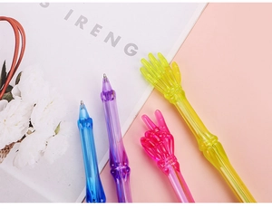 Detail of creative skeleton ballpoint pens with vibrant colors and fun hand gestures