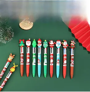 Close-up of Christmas 4-color ballpoint pens with cute silicone Santa and reindeer toppers