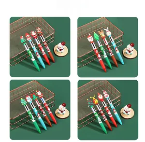 Detail view of 4-color Christmas ballpoint pens with Santa and reindeer rubber toppers