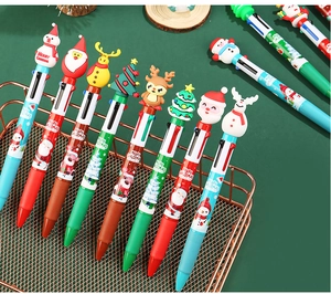 Detail of Christmas multi-color ballpoint pens with cartoon character silicone toppers