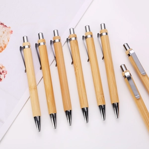Bamboo retractable ballpoint pens with natural wood grain and polished silver metal accents