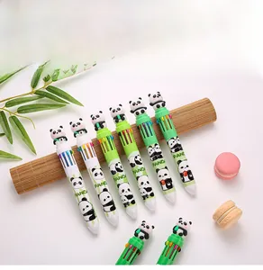 Detailed view of ten-color panda ballpoint pens with cartoon figures on bamboo mat