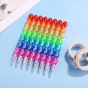Close-up of nine colorful stackable pencils in vibrant rainbow colors on a blue background