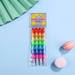 Detail of 4-piece stackable rainbow pencils in transparent packaging with colorful props