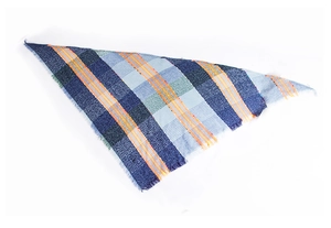 Close-up of blue and green plaid triangle scarf with frayed edges and orange accents