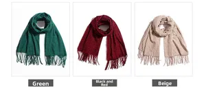 Detail of plaid scarves in green, black-red, and pink with classic tassels and soft texture