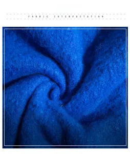 Detail shot of navy blue thick textured fabric with soft plush mohair fibers and fringe