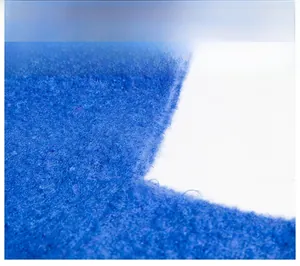 Macro shot of royal blue knit fabric showing soft mohair texture and thick fiber details