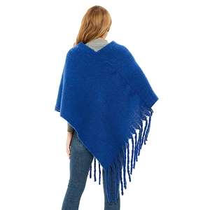 Royal blue knitted poncho with fringe tassels, cozy winter wrap sweater for women